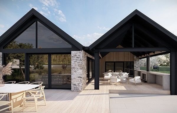 Zwarte gevel met natuursteen, terras en buitenkeuken